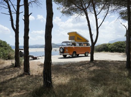 Italy, Sardinia, Posada, man on vacation with an old van